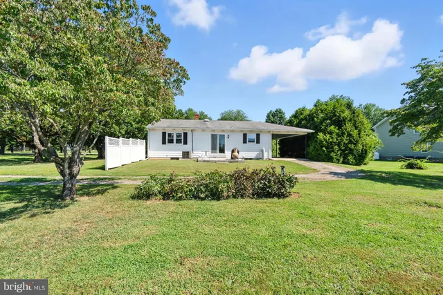 a view of a golf course with a lake view