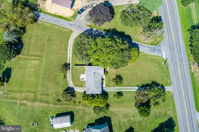 an aerial view of a houses with outdoor space and city view