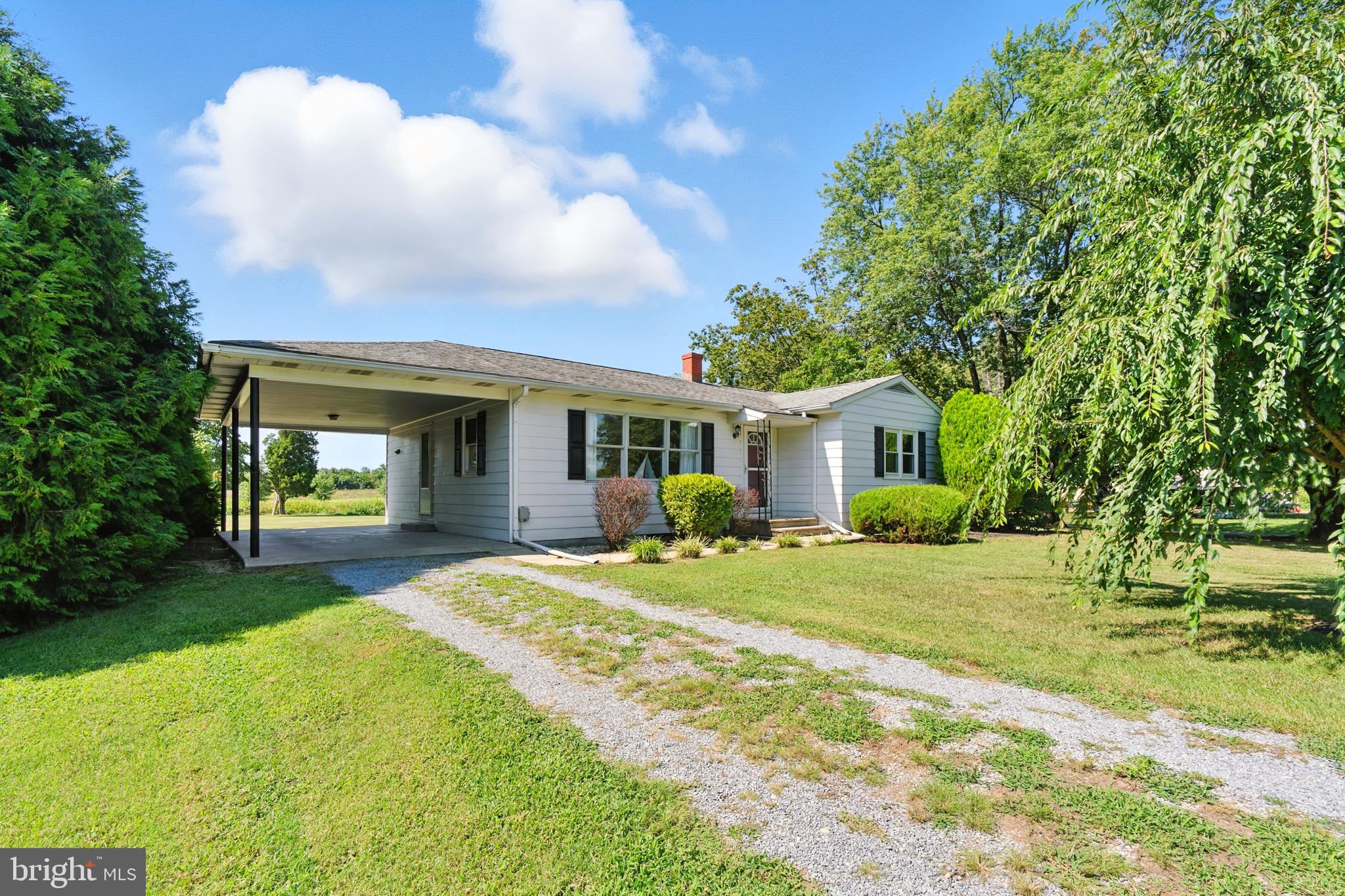 24415 Chestertown Road Chestertown, MD 21620 - Photo 28 of 29 a front view of a house with a yard and porch