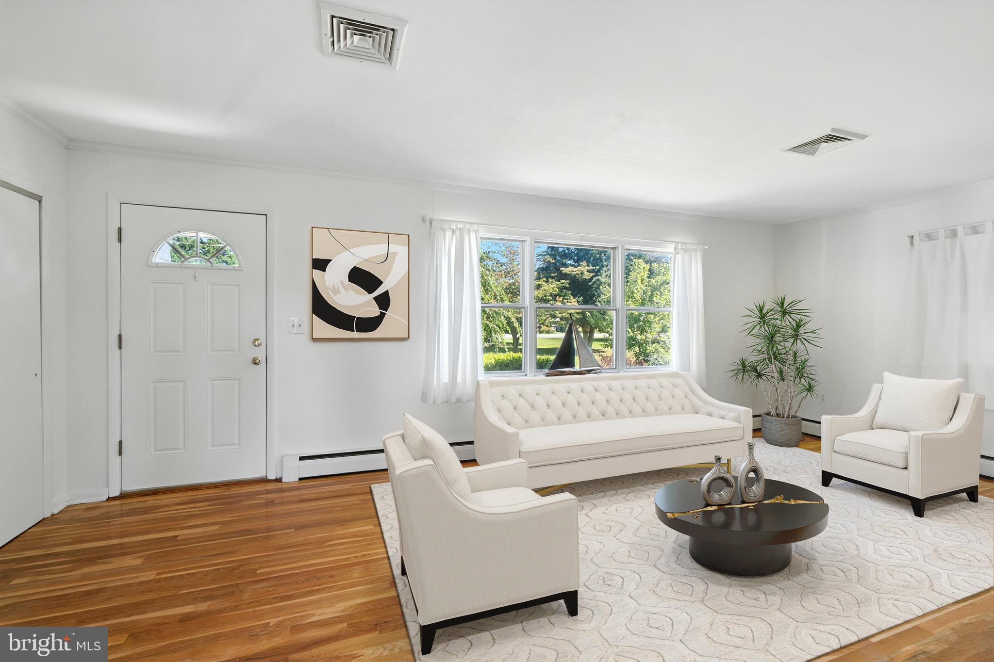 24415 Chestertown Road Chestertown, MD 21620 - Photo 5 of 29 a living room with furniture potted plant and window
