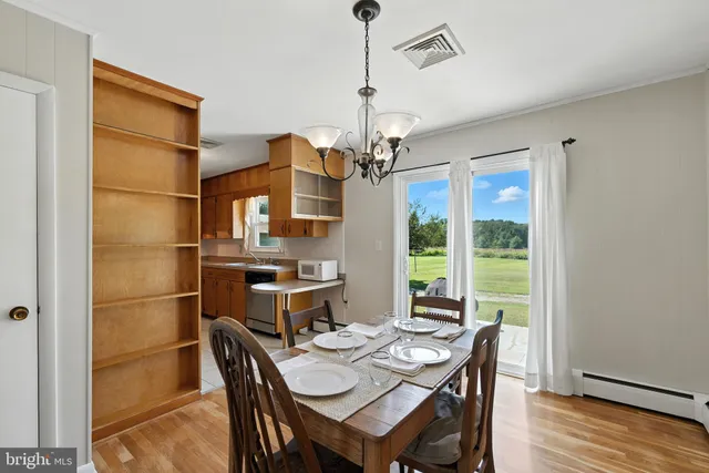 a kitchen with a sink cabinets and window