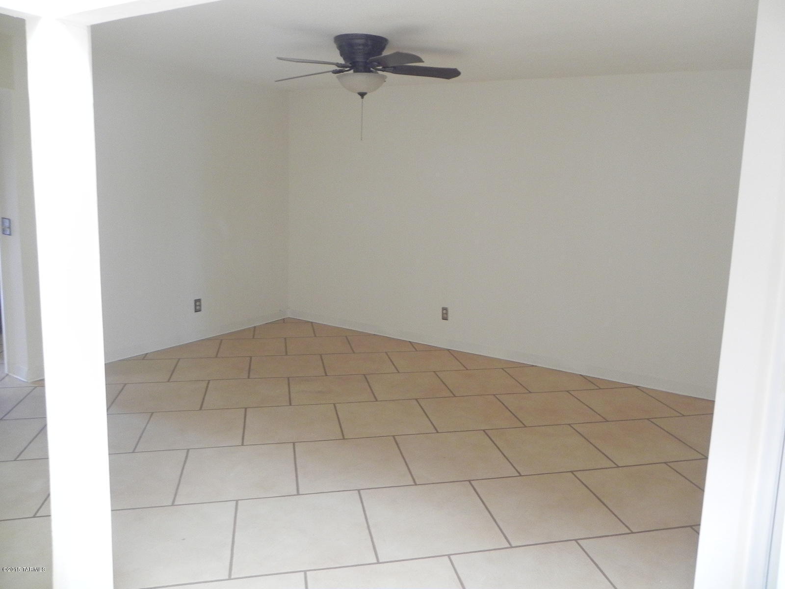 3550 South Mission Road, Unit B Tucson, AZ 85713 - Photo 3 of 15 a view of a room with racks on the wall