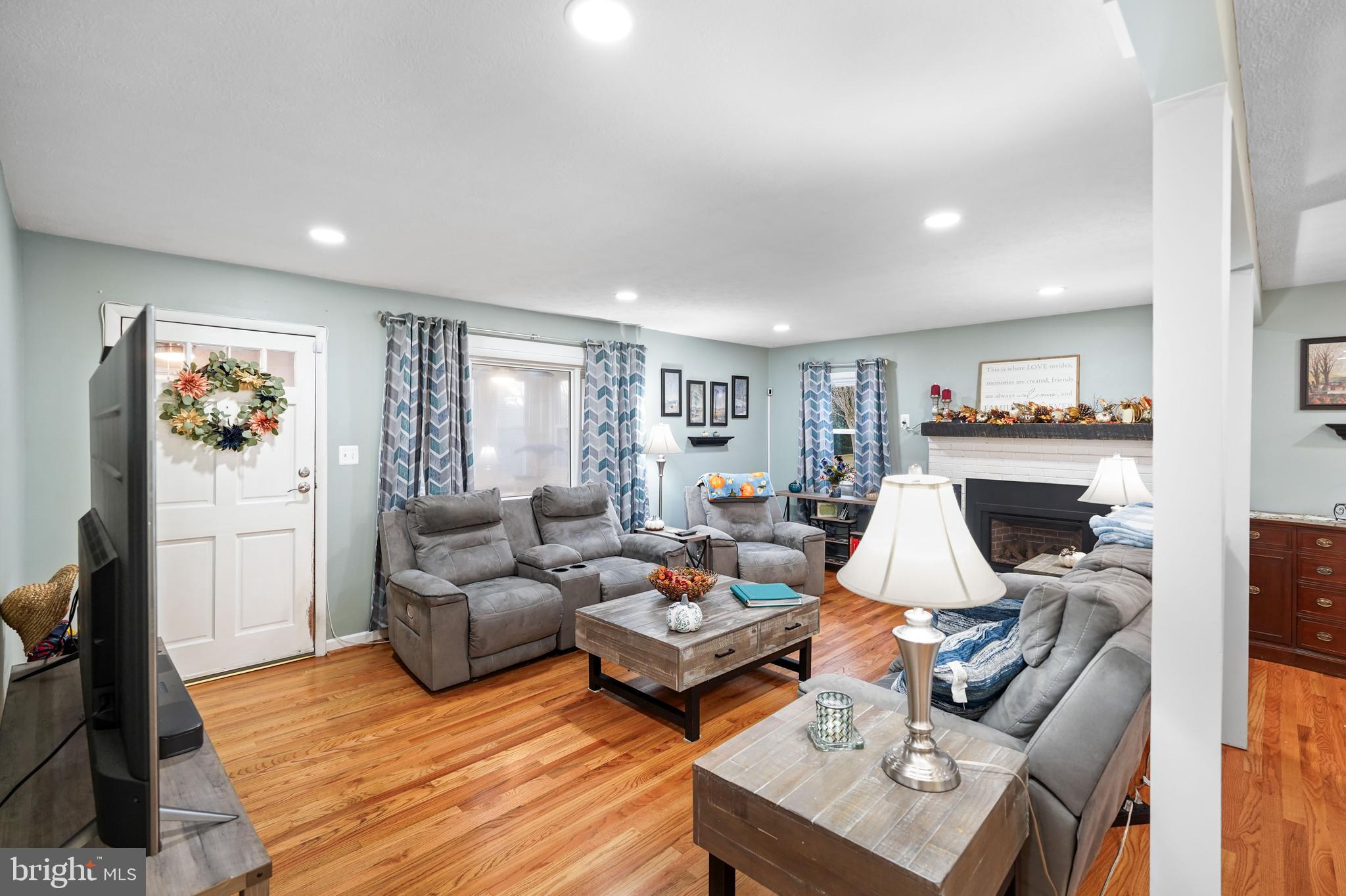 10012 Ellis Road Manassas, VA 20111 - Photo 15 of 54 a living room with furniture and a wooden floor