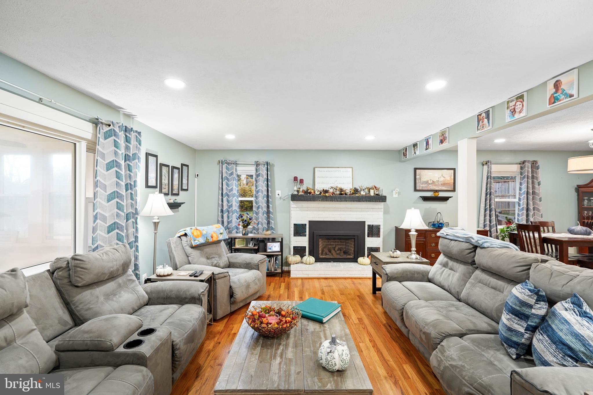 10012 Ellis Road Manassas, VA 20111 - Photo 18 of 54 a living room with furniture fireplace and a large window