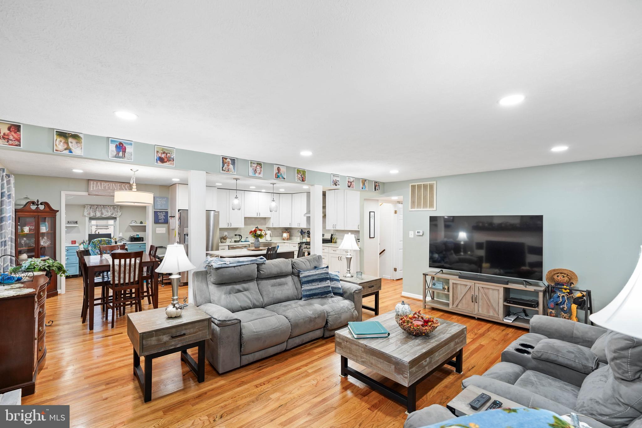 10012 Ellis Road Manassas, VA 20111 - Photo 19 of 54 a living room with furniture and a flat screen tv