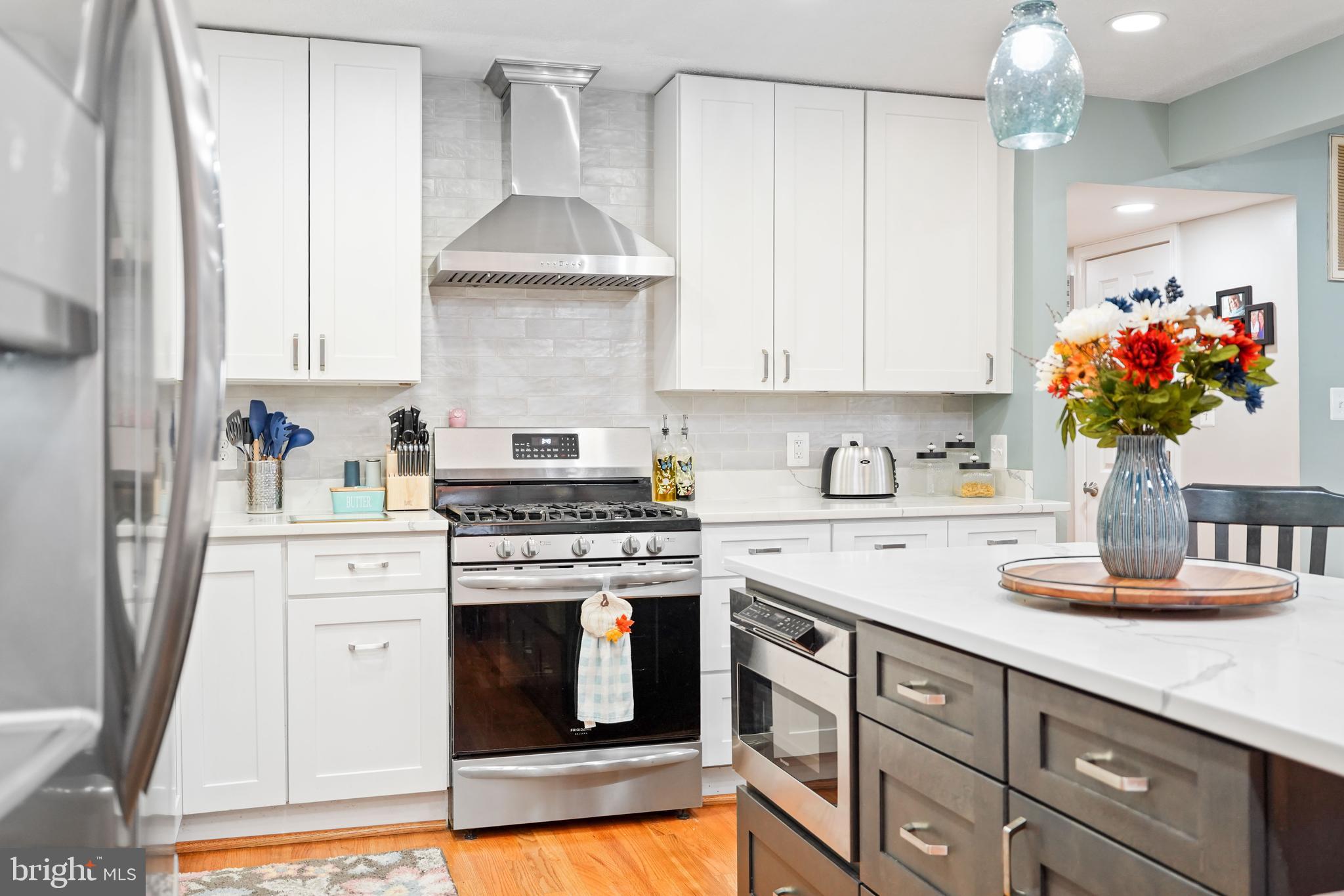 10012 Ellis Road Manassas, VA 20111 - Photo 20 of 54 a kitchen with stainless steel appliances white cabinets and a sink