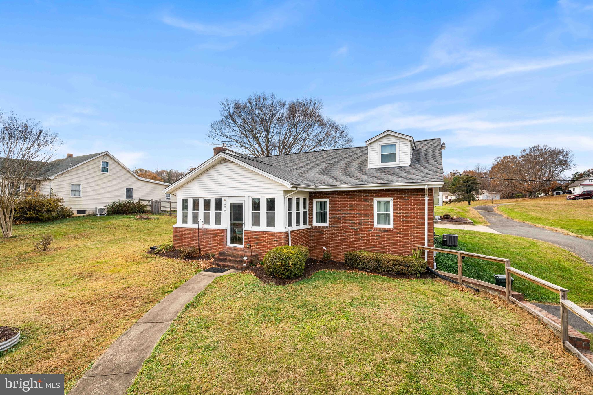 10012 Ellis Road Manassas, VA 20111 - Photo 2 of 54 a front view of a house with a yard