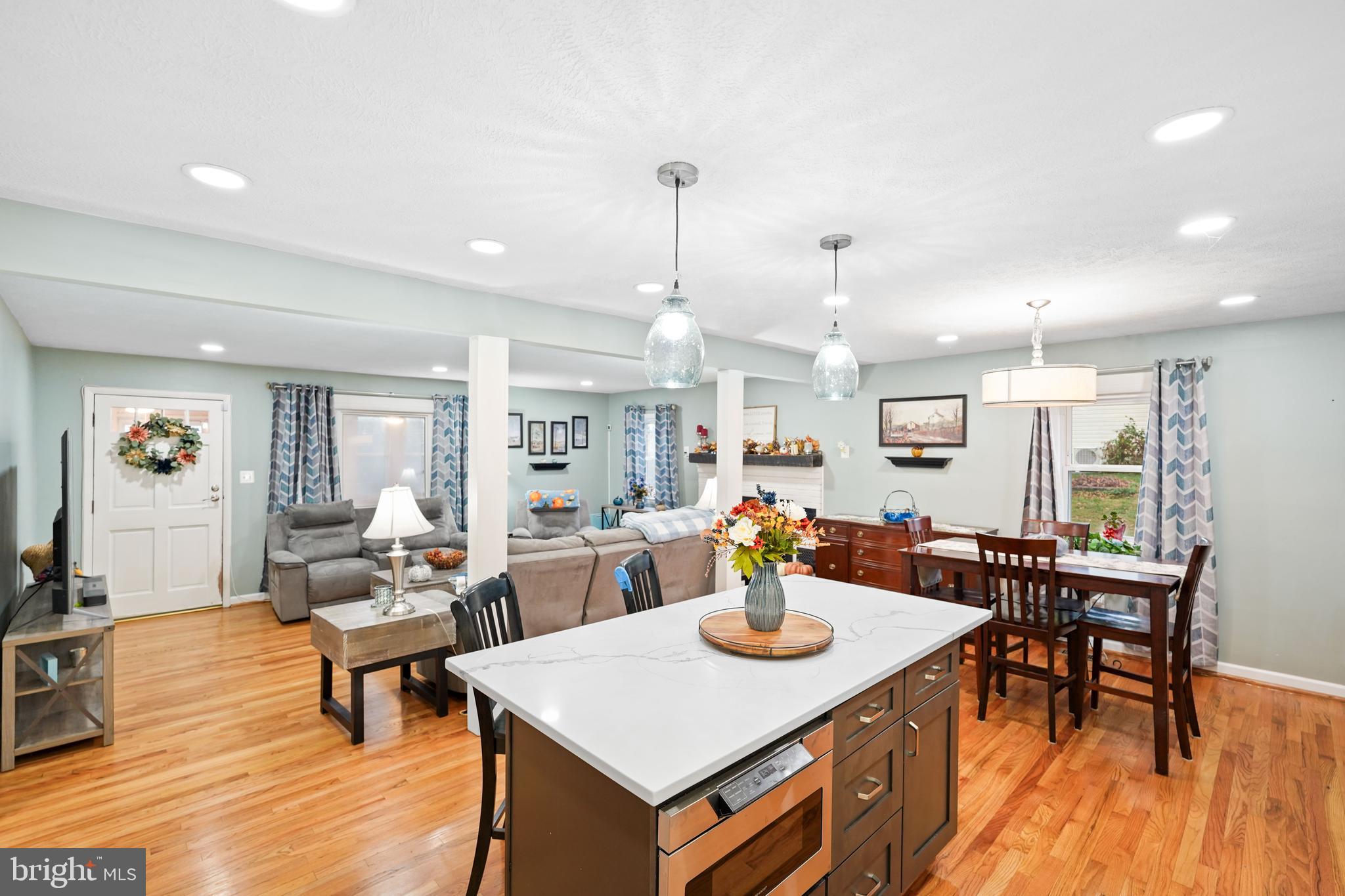 10012 Ellis Road Manassas, VA 20111 - Photo 22 of 54 a view of a dining room with furniture and wooden floor