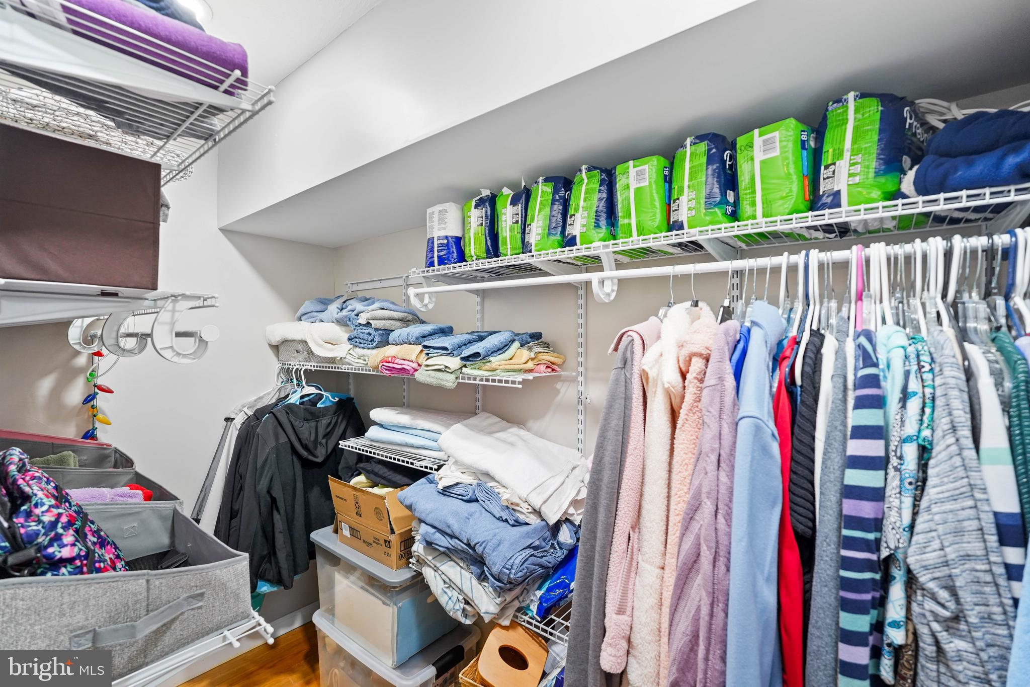 10012 Ellis Road Manassas, VA 20111 - Photo 28 of 54 a view of walk in closet with clothes and shoes