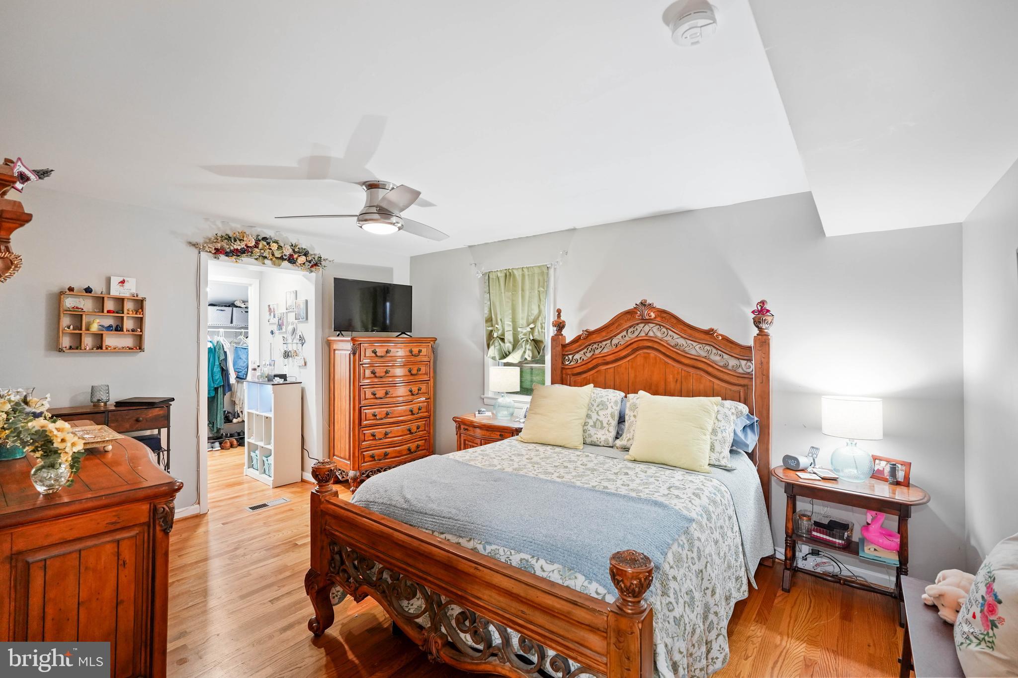 10012 Ellis Road Manassas, VA 20111 - Photo 32 of 54 a bedroom with a bed and wooden floor