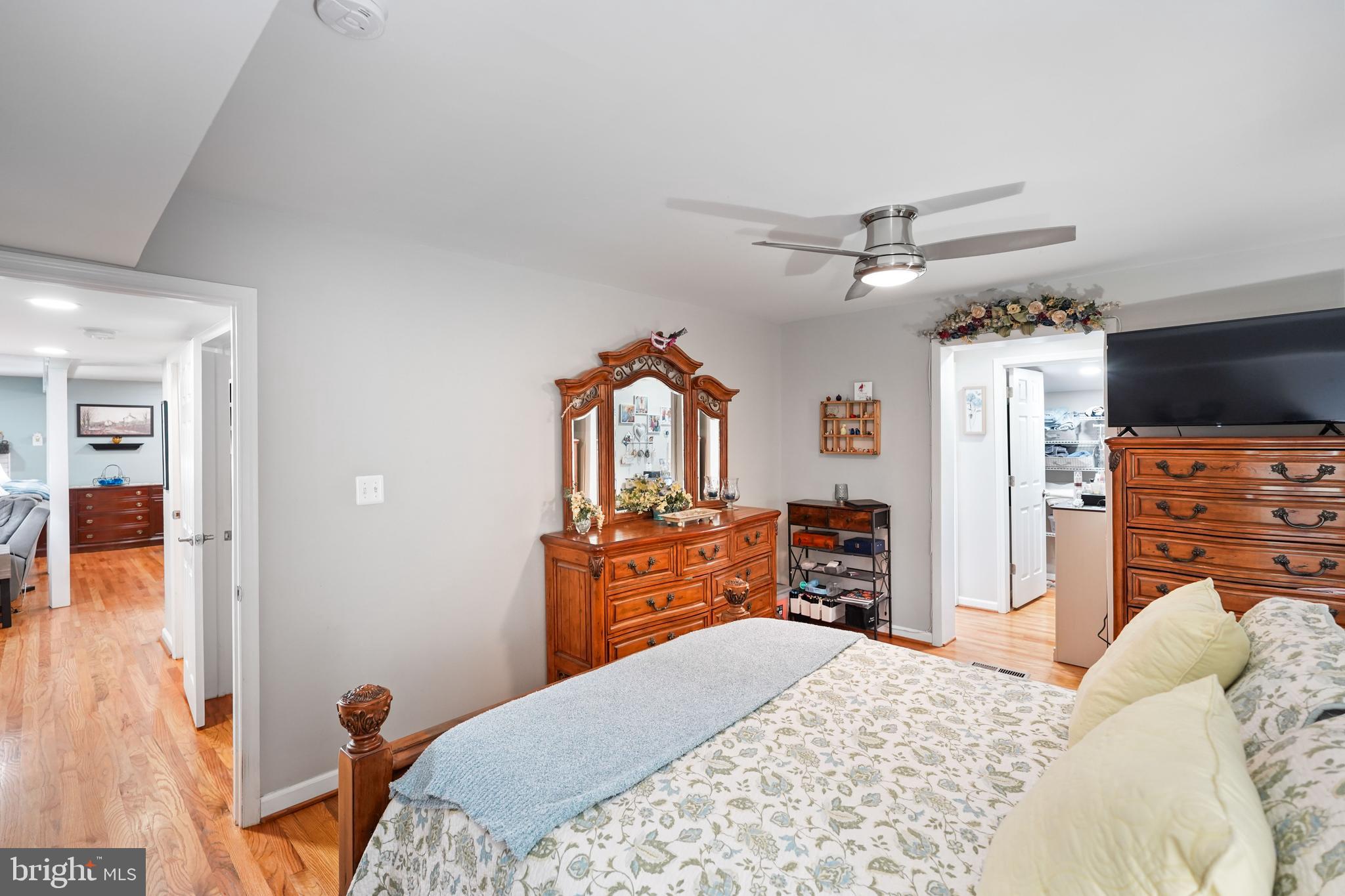 10012 Ellis Road Manassas, VA 20111 - Photo 33 of 54 a bedroom with a bed and a dresser