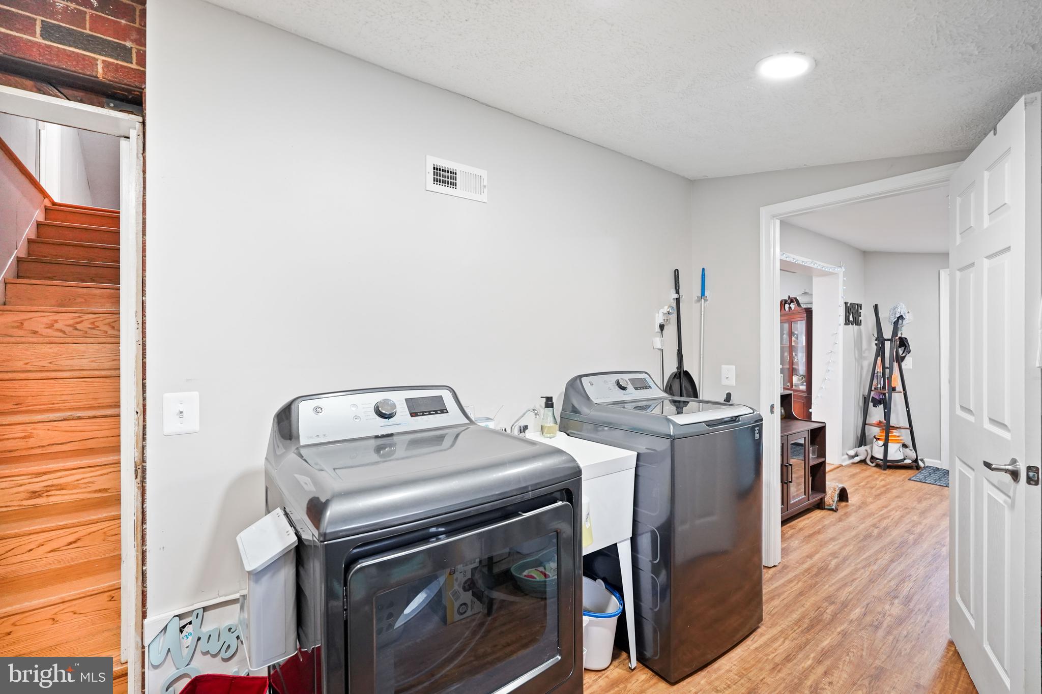 10012 Ellis Road Manassas, VA 20111 - Photo 40 of 54 a view of a storage & utility room with washer and dryer