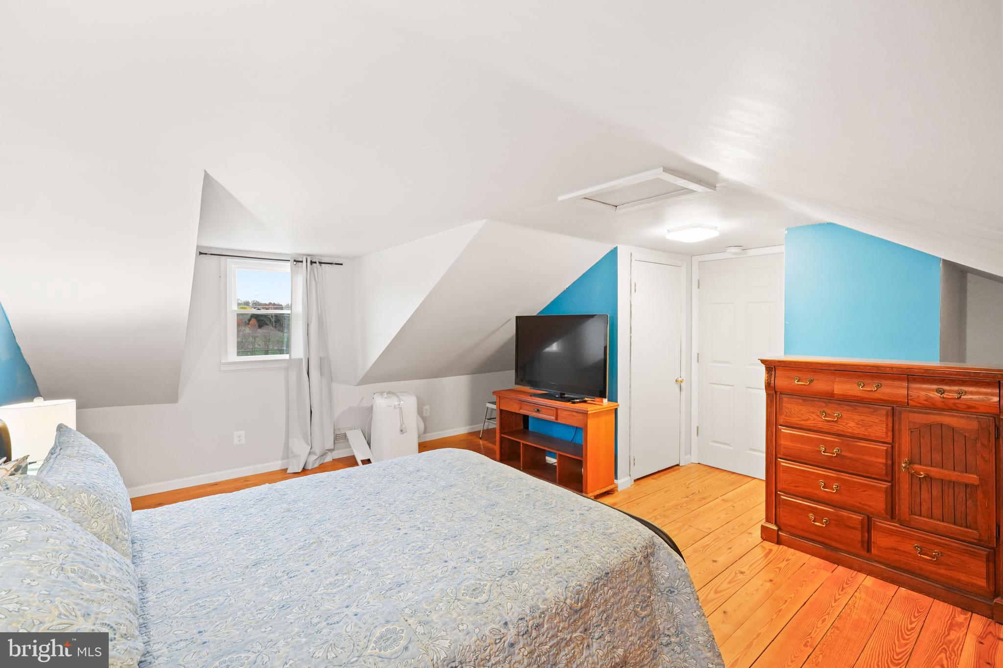 10012 Ellis Road Manassas, VA 20111 - Photo 45 of 54 a bedroom with a bed and a flat screen tv