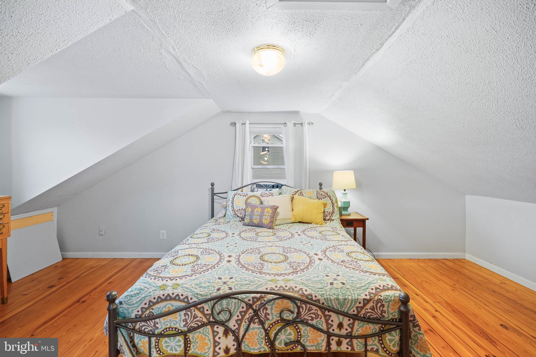 10012 Ellis Road Manassas, VA 20111 - Photo 46 of 54 a bedroom with a bed and a lamp