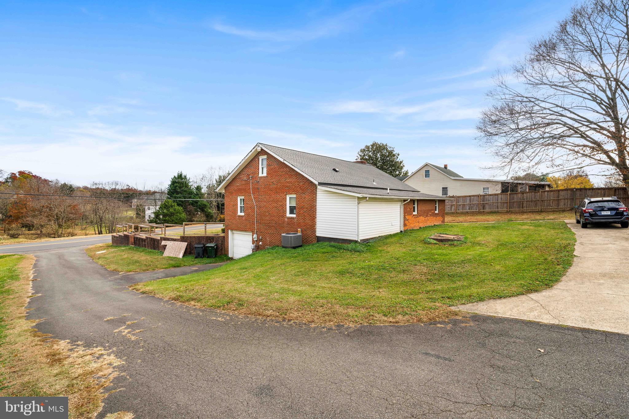 10012 Ellis Road Manassas, VA 20111 - Photo 5 of 54 a view of a house with swimming pool and a yard