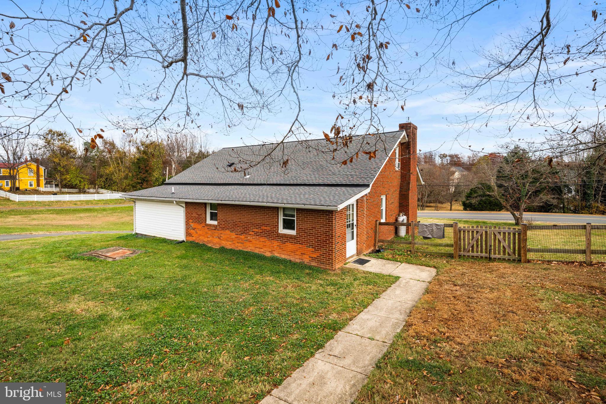 10012 Ellis Road Manassas, VA 20111 - Photo 6 of 54 a view of a house with a yard