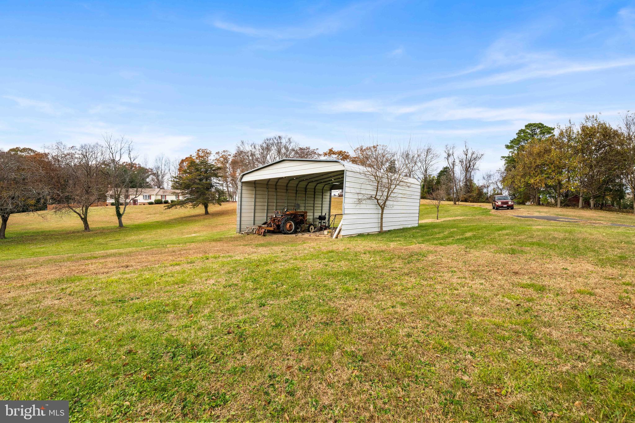 10012 Ellis Road Manassas, VA 20111 - Photo 9 of 54 a view of a house with a yard and sitting area