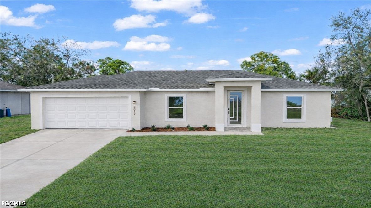 a front view of house with yard and green space