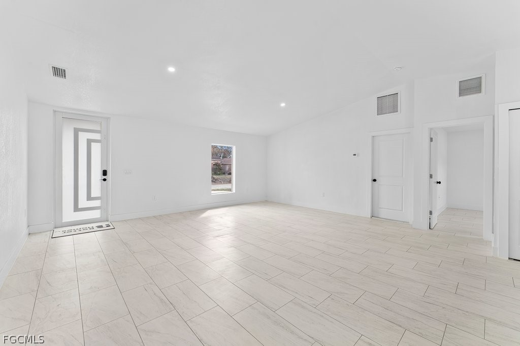 2512 42nd Street Southwest Lehigh Acres, FL 33976 - Photo 6 of 25 a view of an empty room with a window