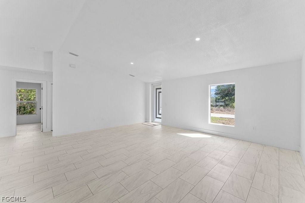 2512 42nd Street Southwest Lehigh Acres, FL 33976 - Photo 7 of 25 an empty room with windows and closet