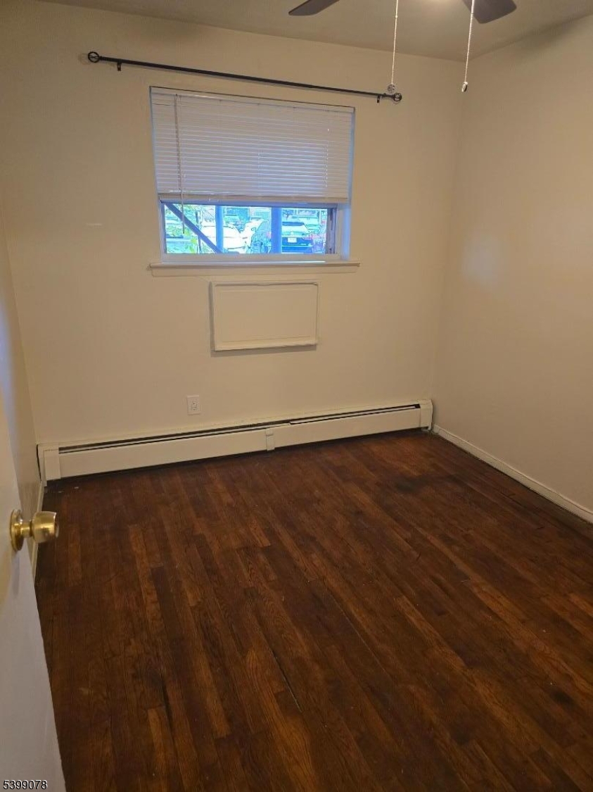 22 Sunset Avenue, Unit 2 Bayonne, NJ 07002 - Photo 3 of 11 a view of a room with wooden floor