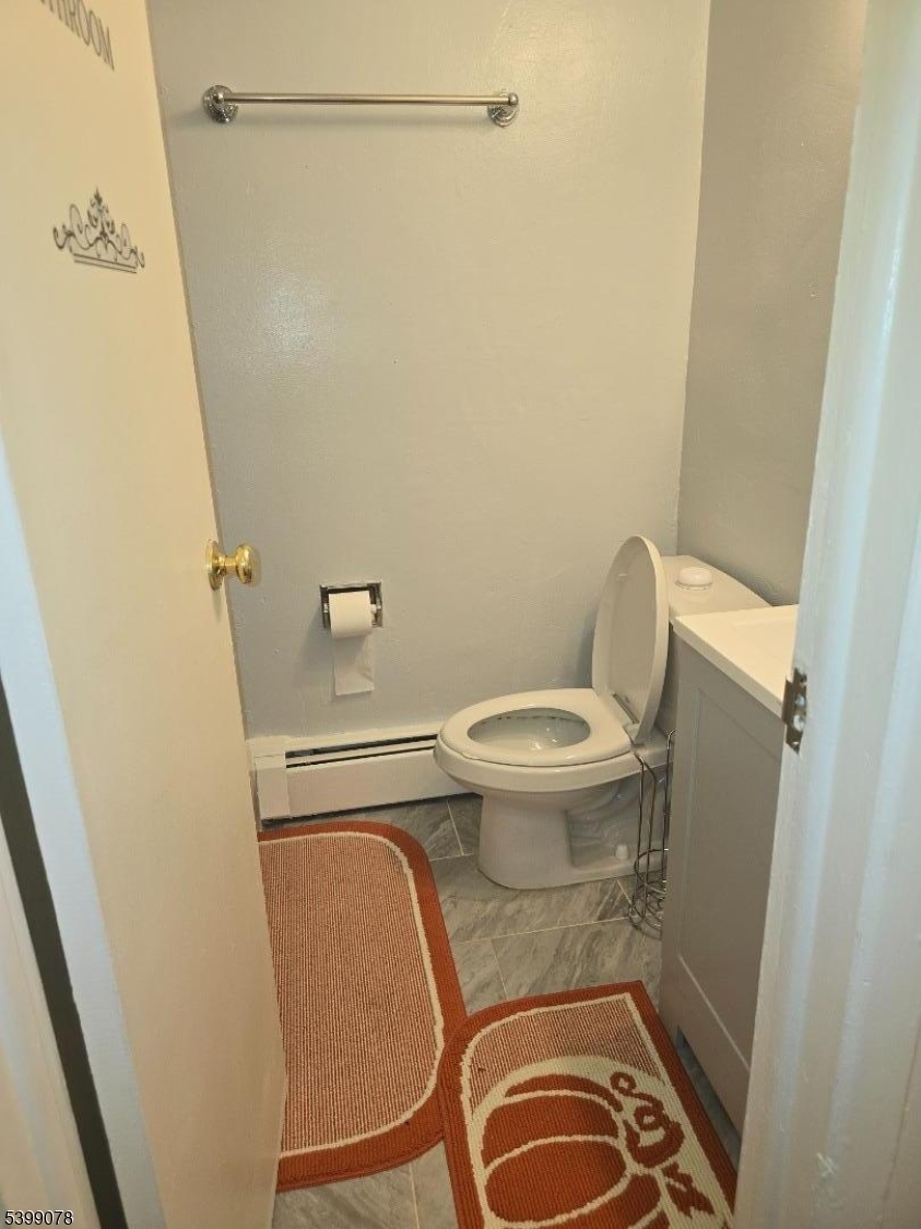 22 Sunset Avenue, Unit 2 Bayonne, NJ 07002 - Photo 7 of 11 a bathroom with a toilet and a shower