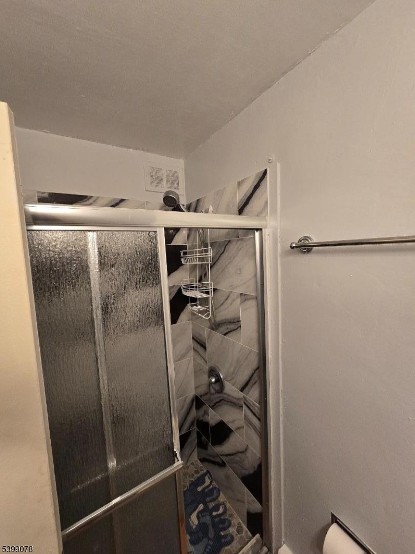 22 Sunset Avenue, Unit 2 Bayonne, NJ 07002 - Photo 8 of 11 a bathroom with a shower