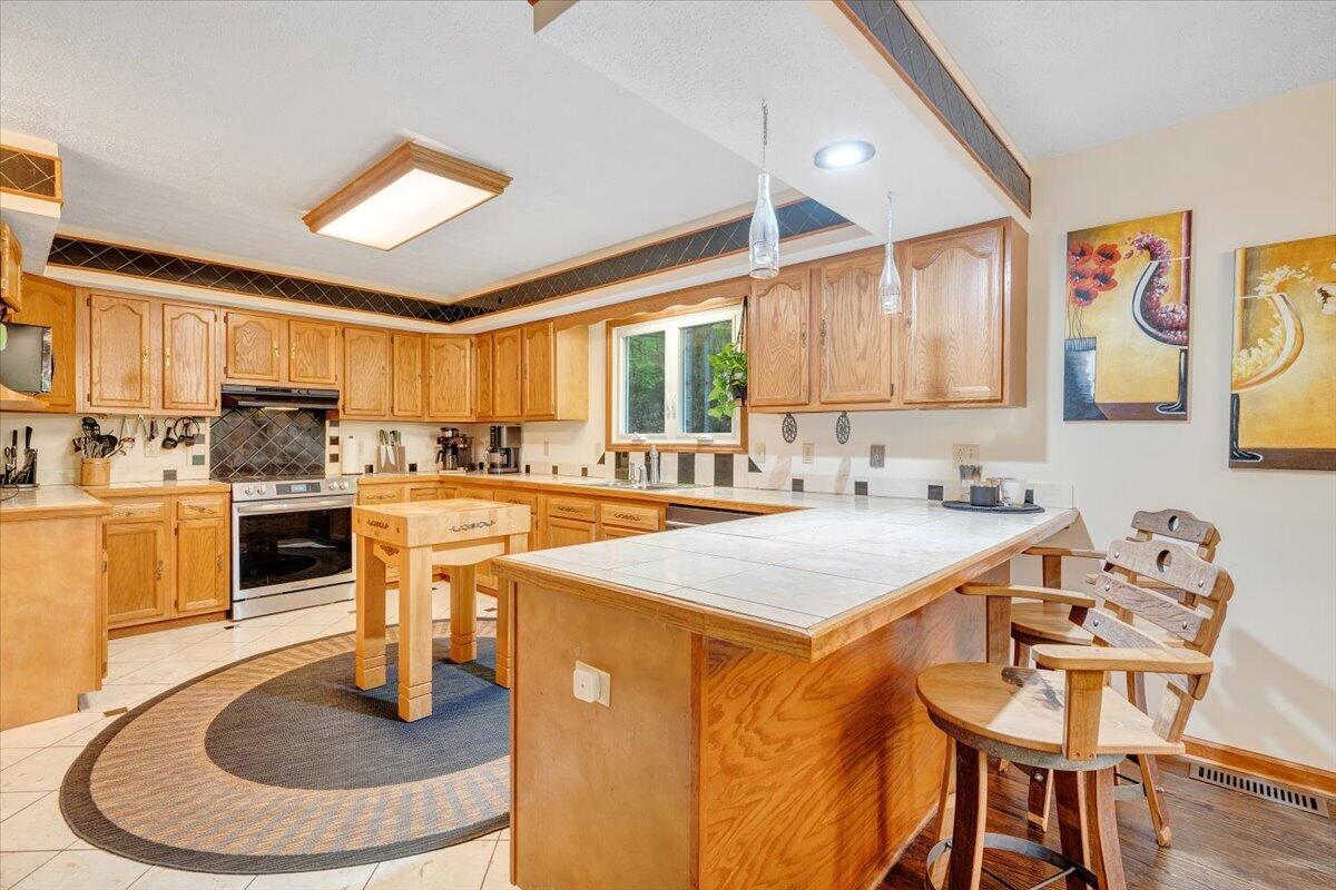 290 Silver Shadow Road Hardy, VA 24101 - Photo 12 of 62 a kitchen with a table chairs and a sink