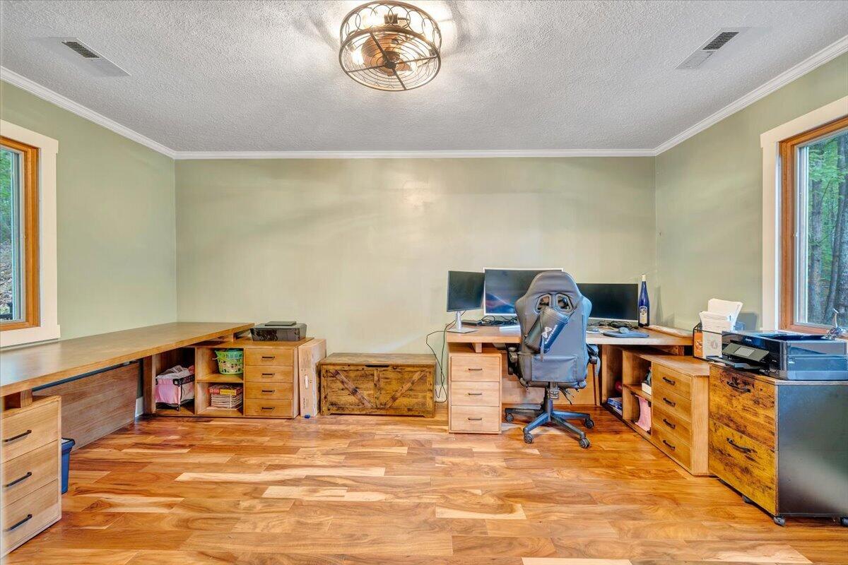 290 Silver Shadow Road Hardy, VA 24101 - Photo 28 of 62 a view of a workspace with furniture and a window