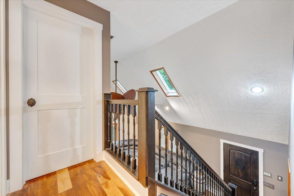 290 Silver Shadow Road Hardy, VA 24101 - Photo 33 of 62 a view of a hallway with wooden floor and staircase