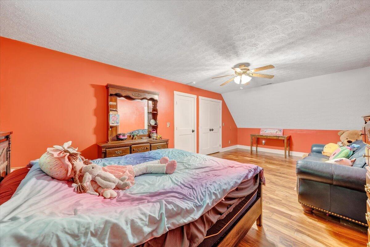 290 Silver Shadow Road Hardy, VA 24101 - Photo 35 of 62 a bedroom with a bed and ceiling fan