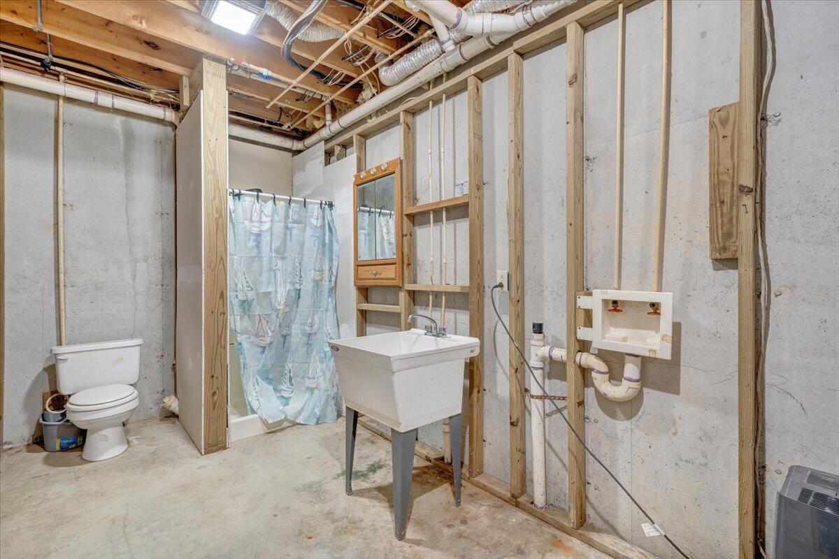 290 Silver Shadow Road Hardy, VA 24101 - Photo 42 of 62 a bathroom with a toilet sink and a shower