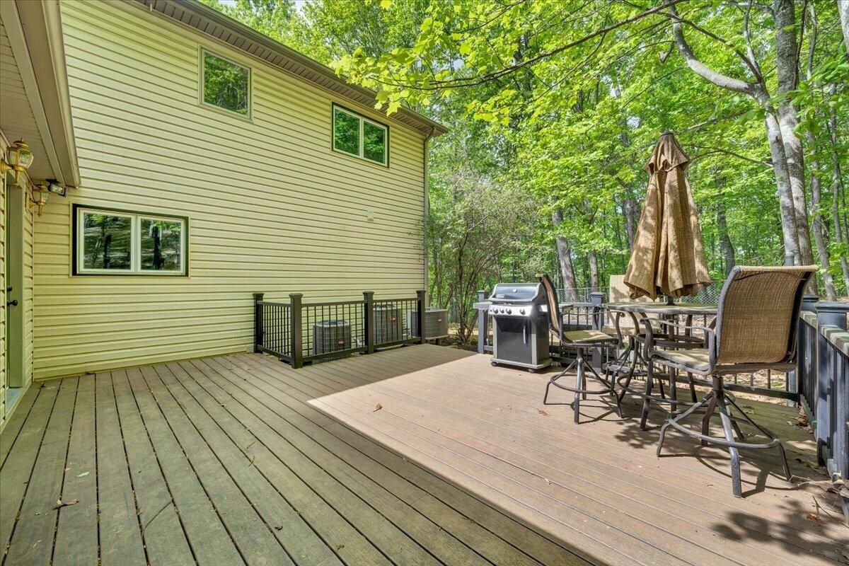 290 Silver Shadow Road Hardy, VA 24101 - Photo 45 of 62 a view of a chairs and table on the wooden deck