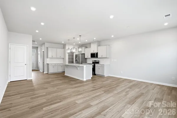 a view of kitchen with wooden floor