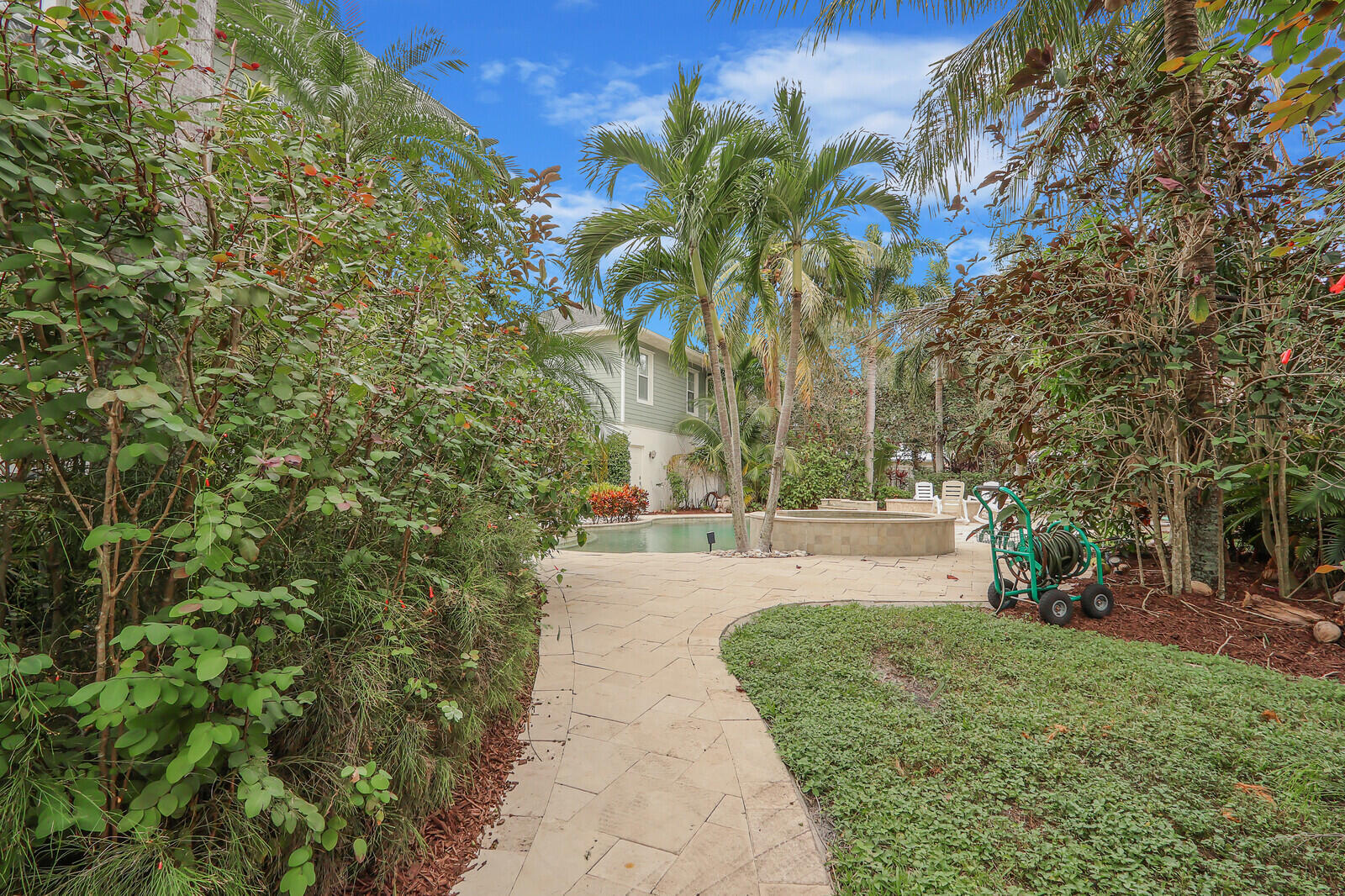 101 St Pierre Way Jupiter, FL 33458 - Photo 49 of 57 a view of a backyard with a garden
