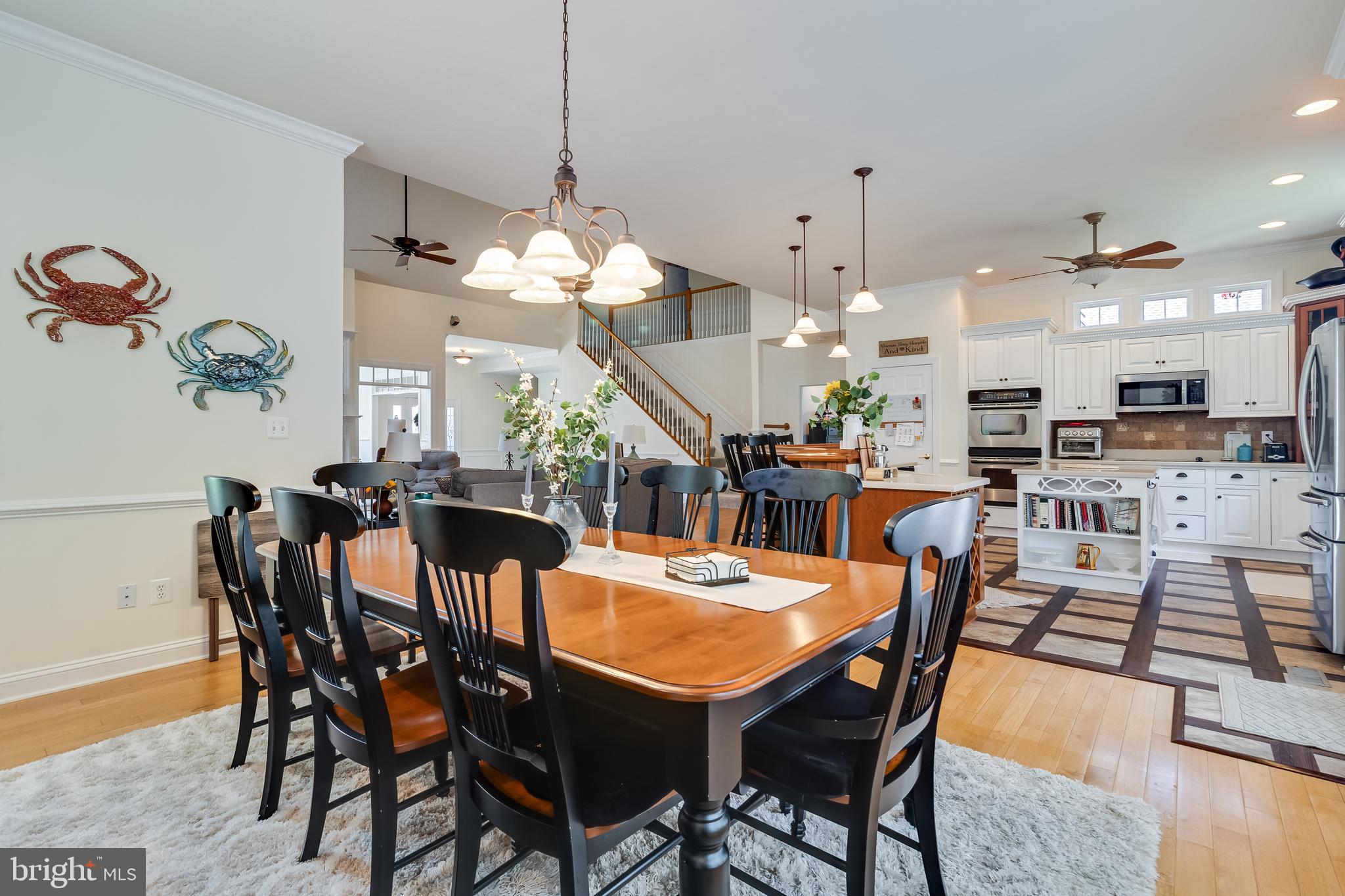 11375 Ethan Court Swan Point, MD 20645 - Photo 19 of 55 a view of a dining room with furniture and wooden floor