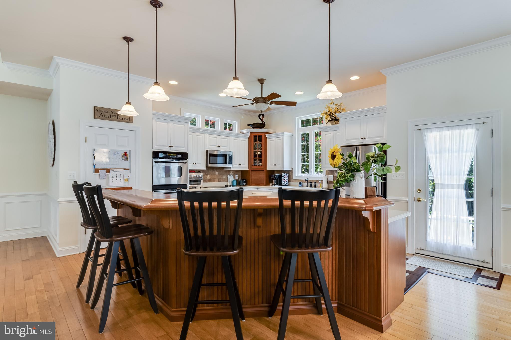 11375 Ethan Court Swan Point, MD 20645 - Photo 21 of 55 a view of a dining room with furniture window and wooden floor