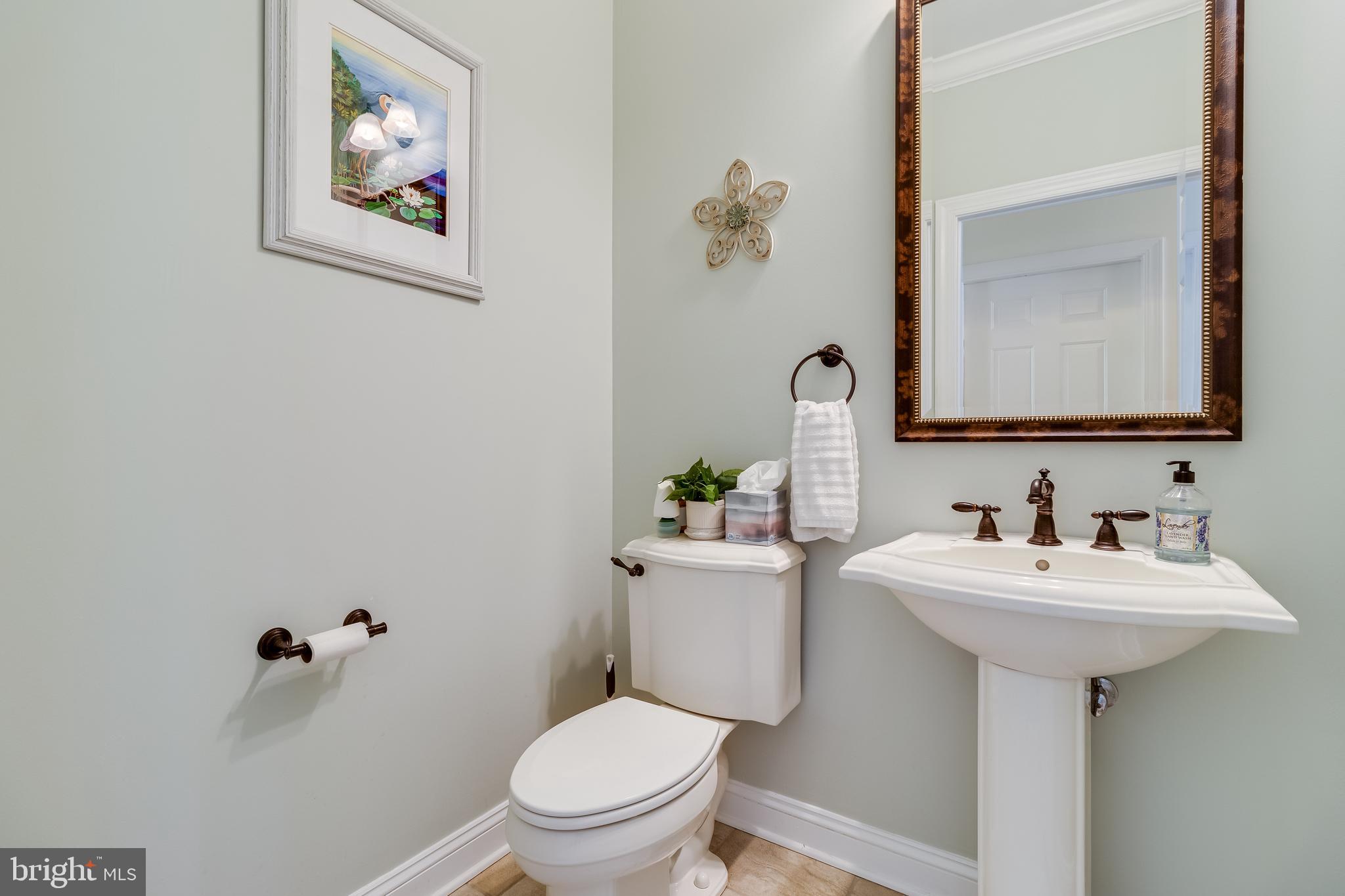 11375 Ethan Court Swan Point, MD 20645 - Photo 26 of 55 a bathroom with a toilet sink and mirror