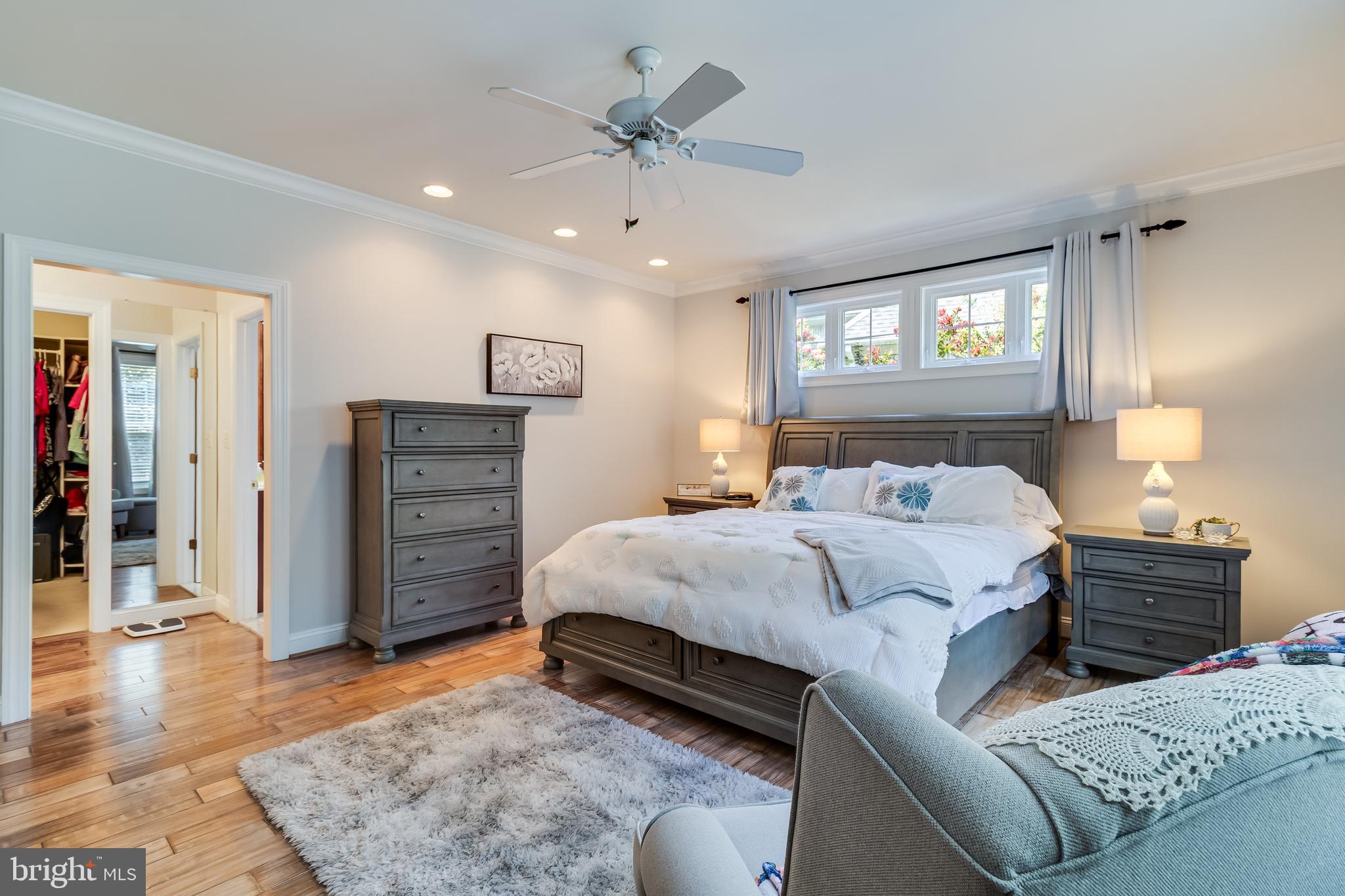 11375 Ethan Court Swan Point, MD 20645 - Photo 28 of 55 a bedroom with a bed and a chandelier