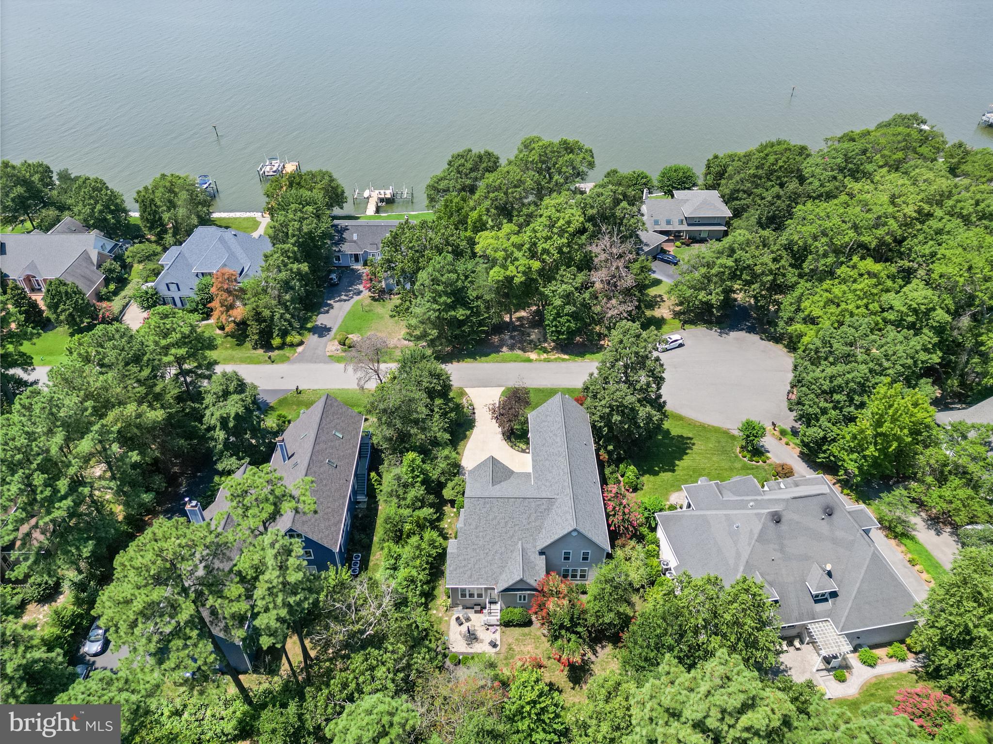11375 Ethan Court Swan Point, MD 20645 - Photo 4 of 55 an aerial view of a house with a yard and garden