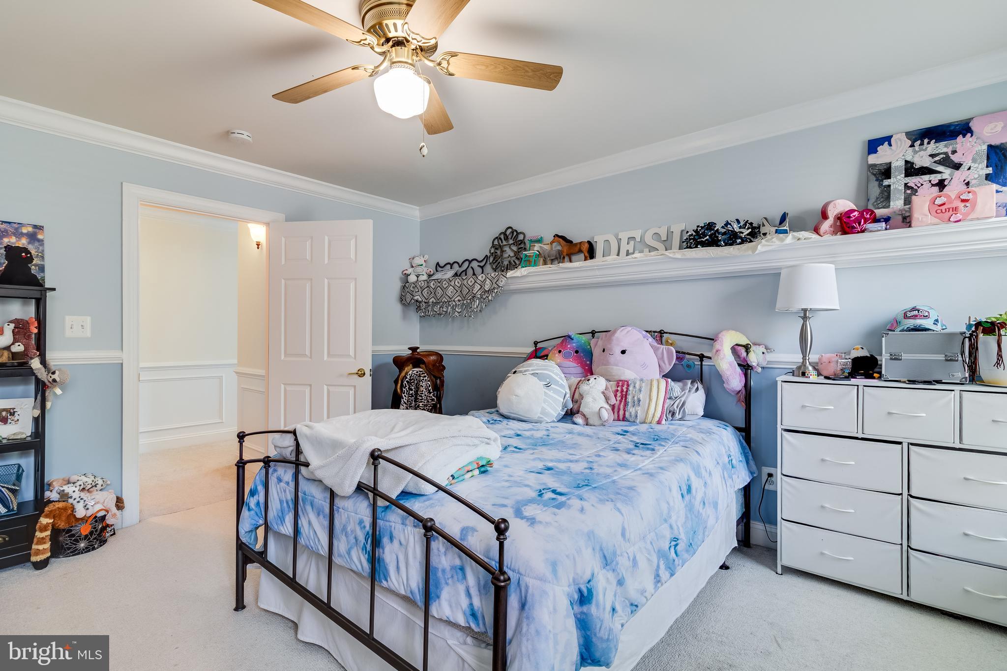 11375 Ethan Court Swan Point, MD 20645 - Photo 44 of 55 a bedroom with a bed and a chandelier