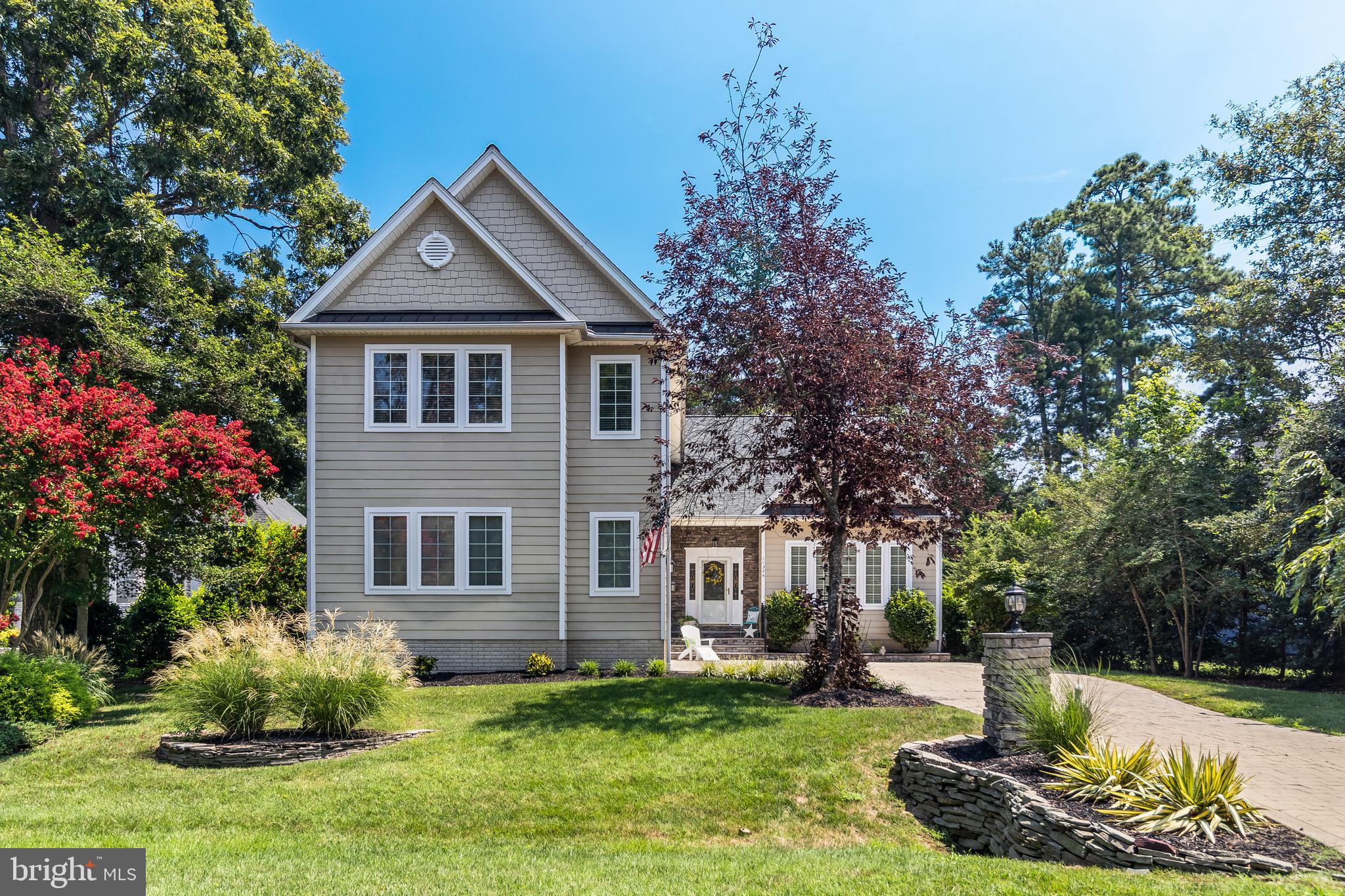 11375 Ethan Court Swan Point, MD 20645 - Photo 6 of 55 a front view of a house with a yard