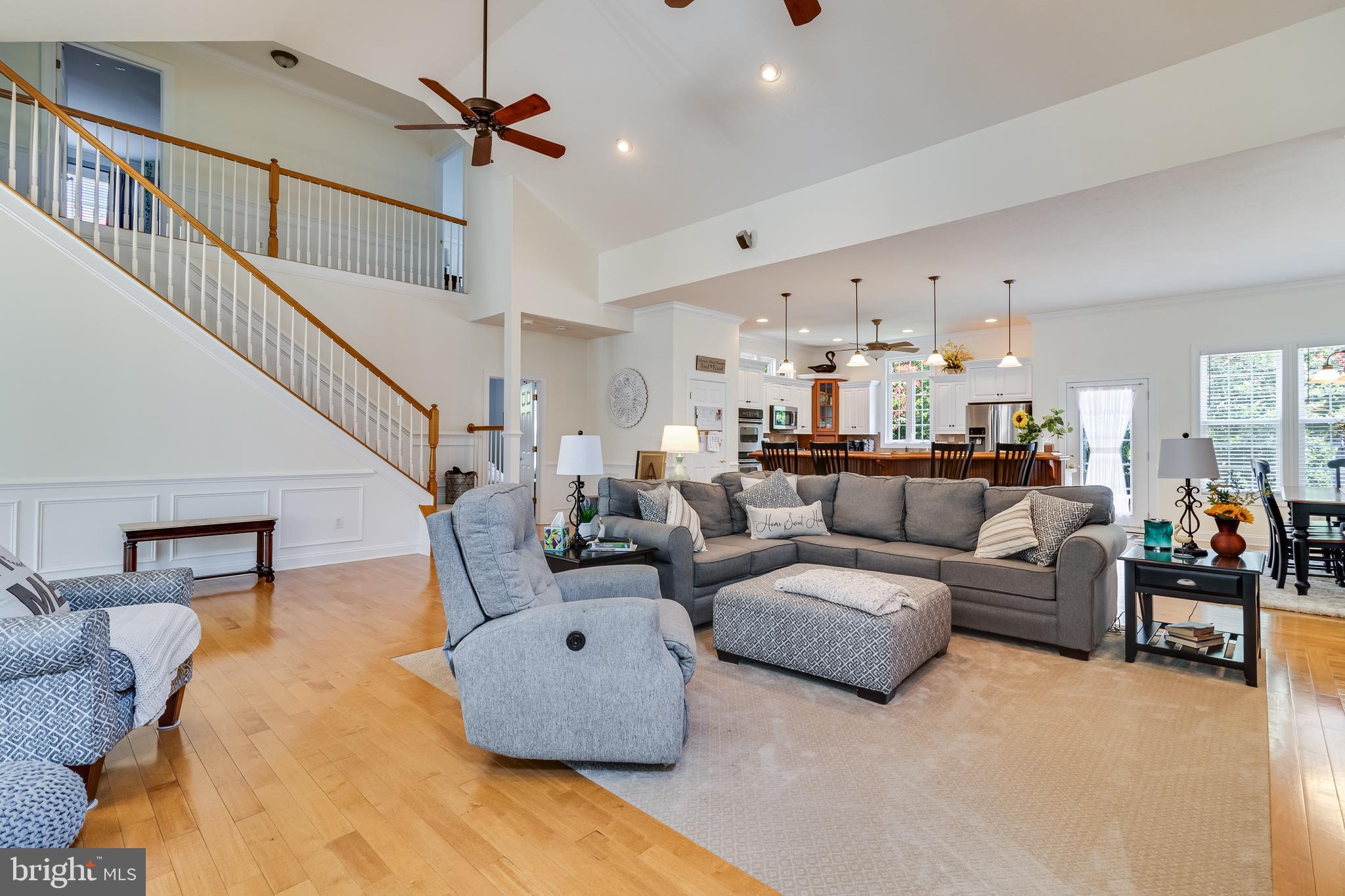 11375 Ethan Court Swan Point, MD 20645 - Photo 8 of 55 a living room with furniture and a chandelier