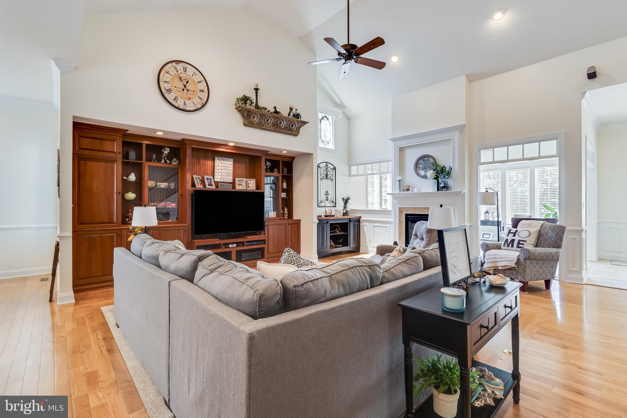 11375 Ethan Court Swan Point, MD 20645 - Photo 10 of 55 a living room with fireplace furniture and a flat screen tv