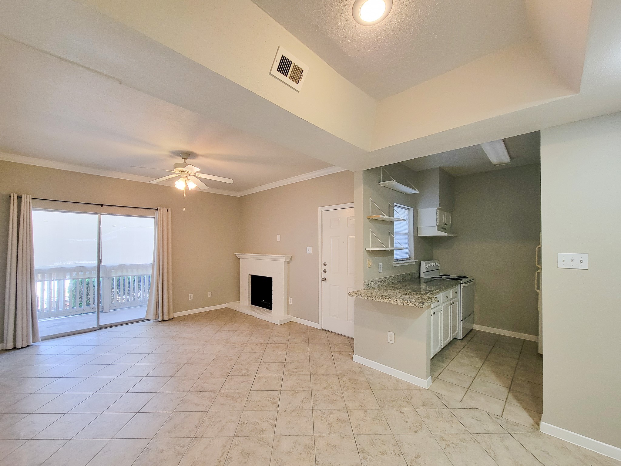 4041 Drake Street, Unit 116 Houston, TX 77005 - Photo 12 of 27 a spacious bathroom with a granite countertop sink a mirror and a bathtub