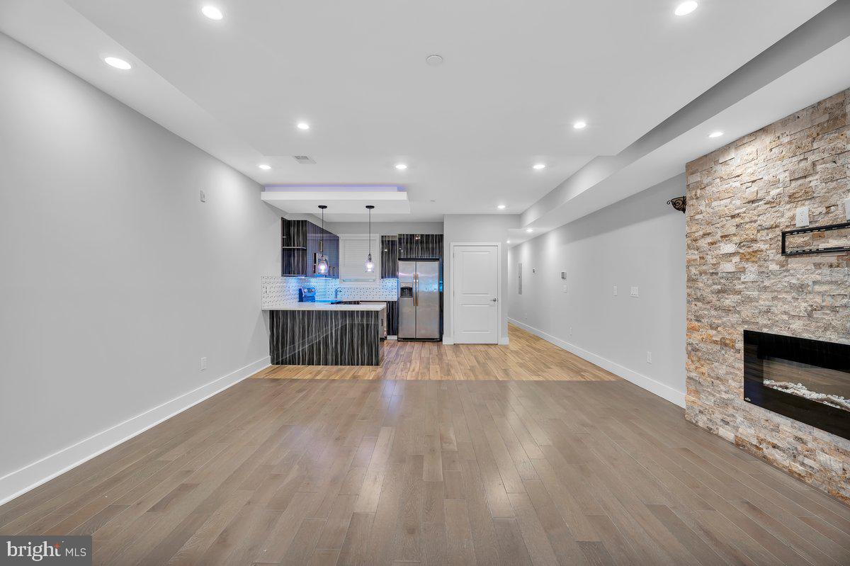 2562 Frankford Avenue, Unit 2 Philadelphia, PA 19125 - Photo 12 of 23 a view of a kitchen with a sink and a fireplace