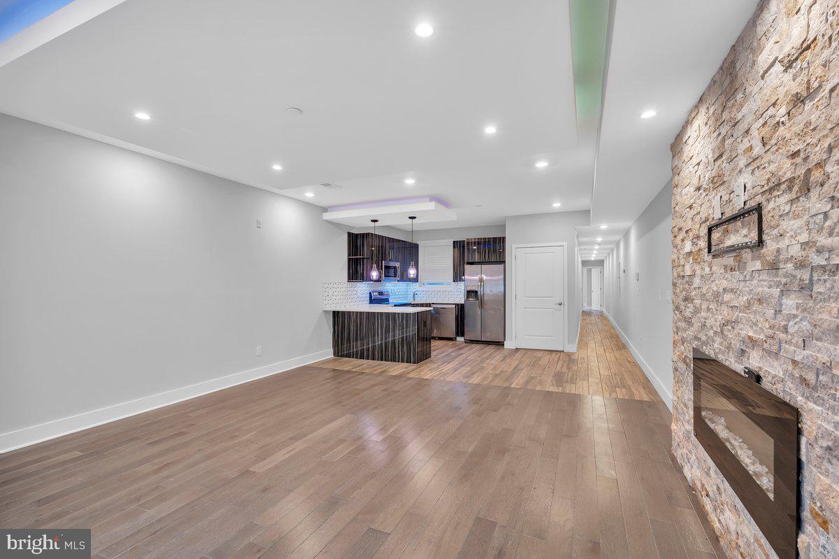 2562 Frankford Avenue, Unit 2 Philadelphia, PA 19125 - Photo 14 of 23 a view of kitchen with kitchen island a sink wooden floor and a stove