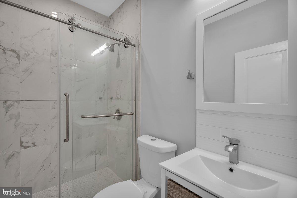 2562 Frankford Avenue, Unit 2 Philadelphia, PA 19125 - Photo 16 of 23 a bathroom with a sink toilet and shower