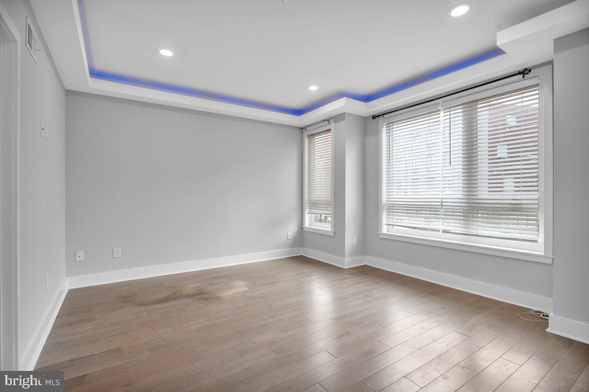 2562 Frankford Avenue, Unit 2 Philadelphia, PA 19125 - Photo 19 of 23 a view of an empty room with wooden floor and a window