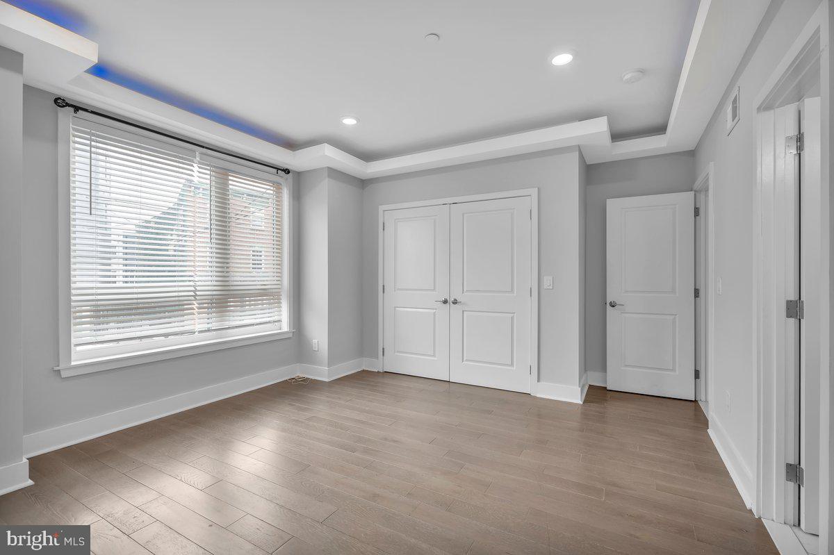 2562 Frankford Avenue, Unit 2 Philadelphia, PA 19125 - Photo 23 of 23 a view of an empty room with wooden floor and a window